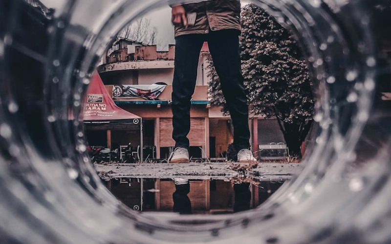 person standing near bottle